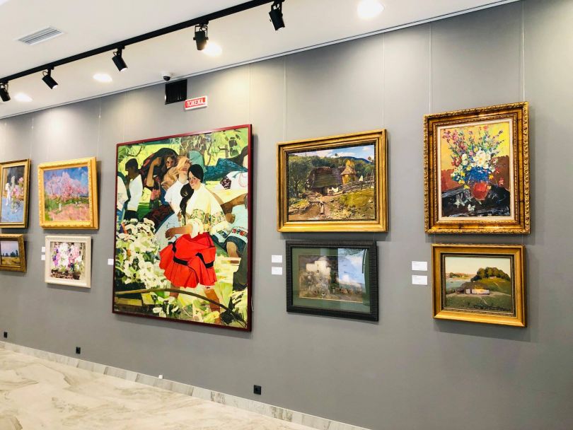 gallery with many paintings on walls